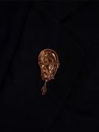The extra ear - brooch