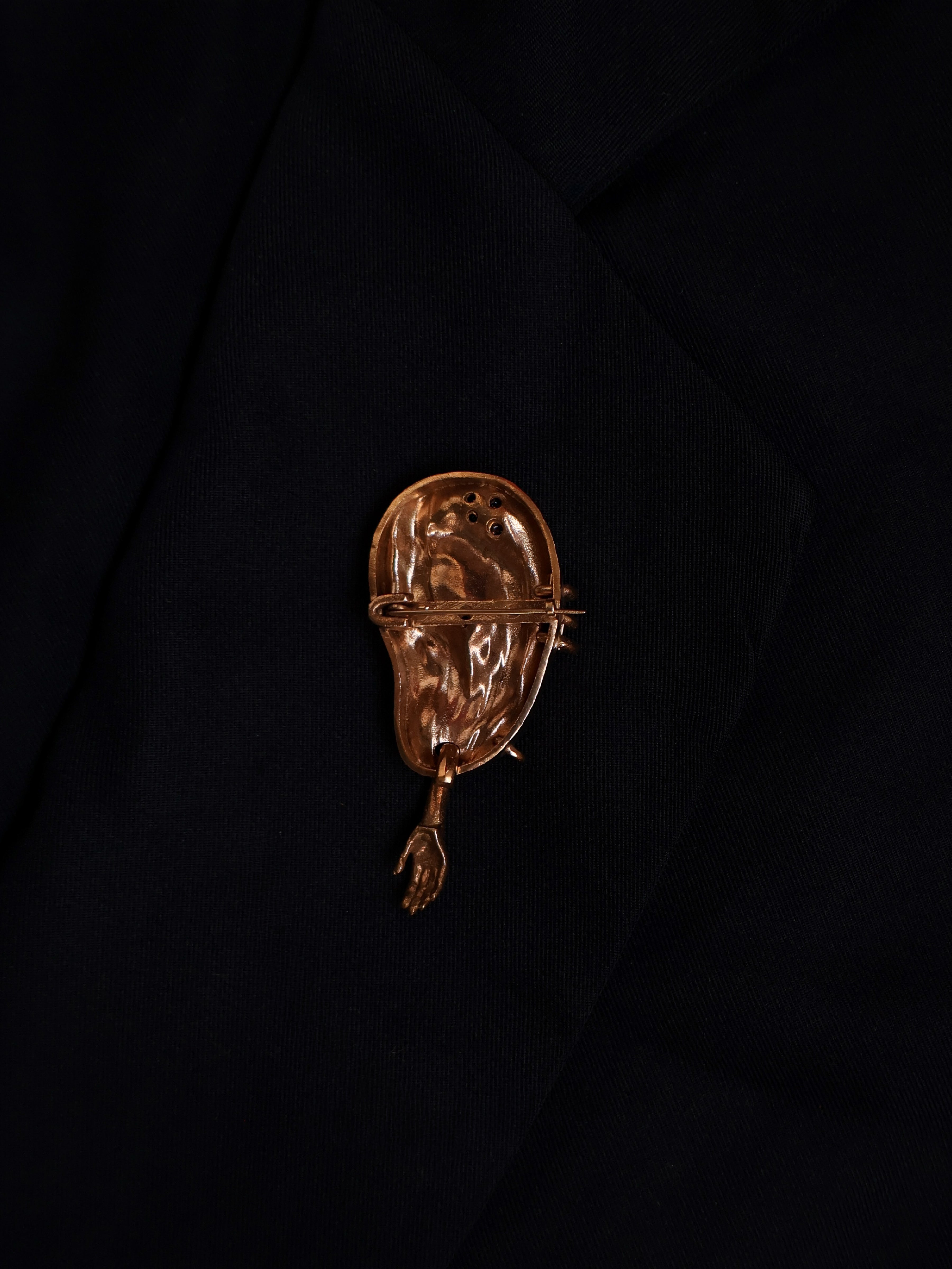 The extra ear - brooch