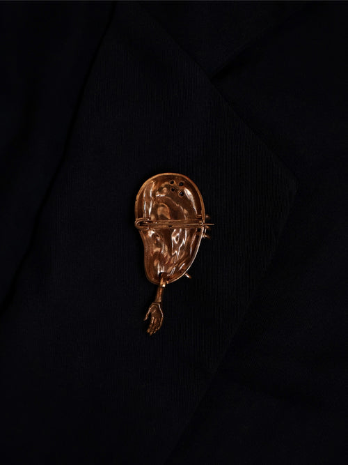 The extra ear - brooch