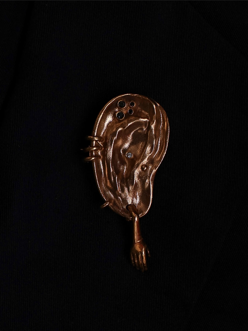 The extra ear - brooch